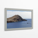 Acantilado Rocoso con Arco Natural y Mar Azul - Wandering Pixels Co. | Cuadro decorativo de Canvas Lab