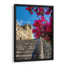 Histórico Monasterio de Yuriria enmarcado por vibrantes bugambilias bajo un cielo azul despejado. - Nosion | Cuadro decorativo de Canvas Lab