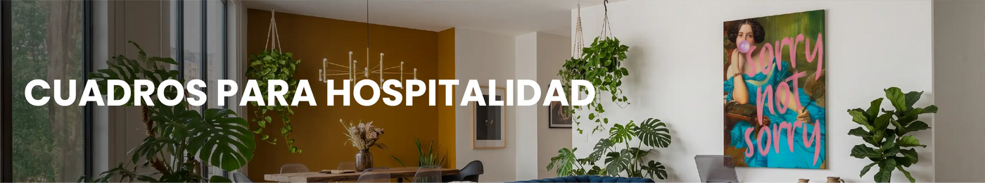 Habitación de hotel boutique decorada con cuadros elegantes de Canvas Lab. Texto: CUADROS PARA HOTELES Y AIRBNBS.
